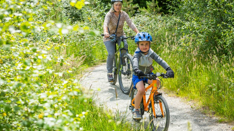 Lady and child exploring the cycle trails at Lanhydrock